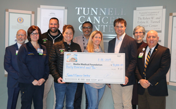 Pictured left to right: Barry Hamp, Executive Director, Oncology Services; Lisa Henderson, RN, Nurse Manager, Tunnell Cancer Center; Al Tortella, Owner, Tortella Enterprises, Paradise Grill; Sandy Samsel, Controller, Tortella Enterprises, Paradise Grill; 