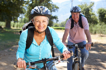 Stay safe this summer by wearing helmets when bicycling.